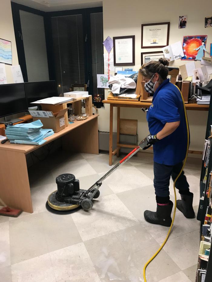 person cleaning floor