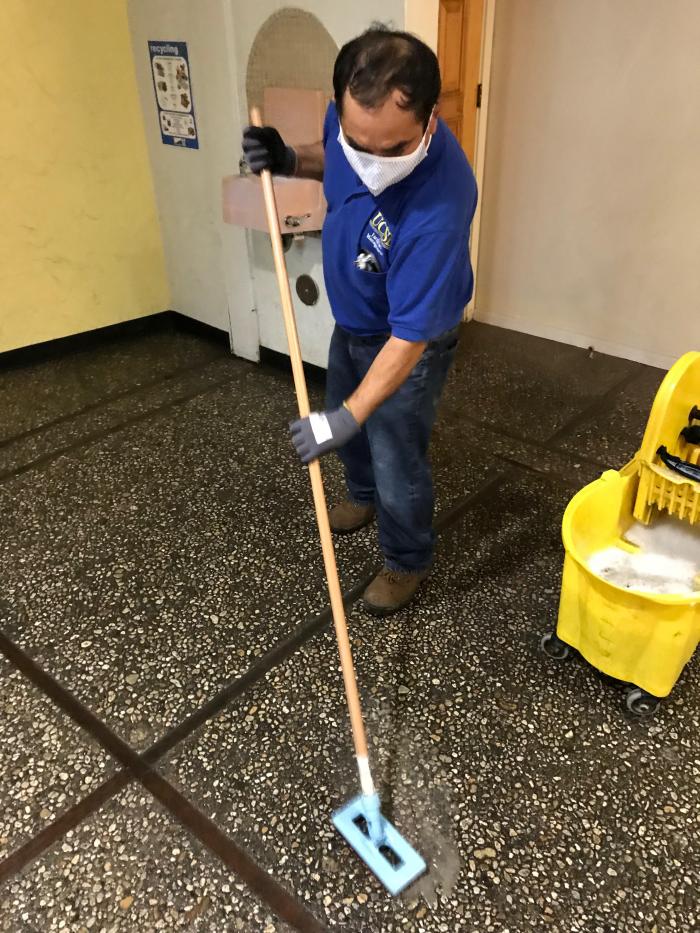 person cleaning floor