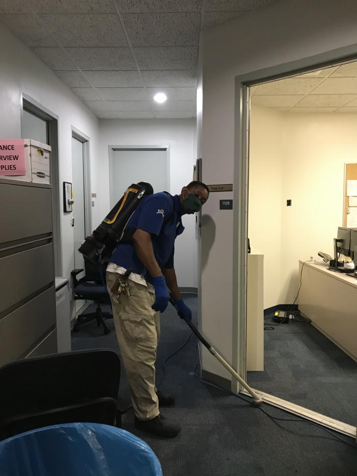 person cleaning floor